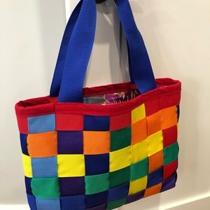 Rainbow seatbelt webbing tote bag. Random rainbow pattern and floral lining.
